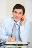 Portrait+of+smiling+businessman+on+the+phone