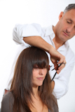 Hairdresser+cutting+woman%27s+hair
