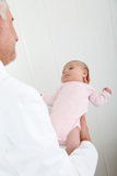 Pediatrician+examining+baby%27s+good+health