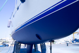 boat+hull+sailboat+blue+antifouling+beached+for+paint+works
