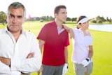 Golf+senior+golfer+man+portrait+in+green+course+outdoor+young+couple+background