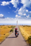 Barbaria+cape+formentera+lighthouse+road+tourist+couple+in+bike