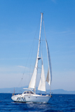 Blue+Mediterranean+sailboat+sailing+in+perfect+ocean