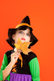Halloween+kid+girl+costume+on+orange+background