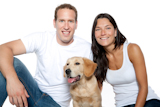 couple+in+love+with+puppy+dog+golden+retriever+isolated+on+white