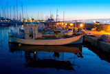 sunset+traditional+fisherboats+in+Formentera+port+marina