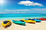 Kayaks+on+the+tropical+beach%2C+Thailand+