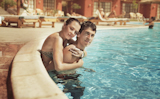 Young+couple+kissing+in+a+swimming+pool