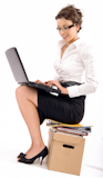 Successful+young+businesswoman+sitting+on+pile+of+documents%2C+lots+of+copy+space