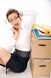 Successful+young+businesswoman+next+to+pile+of+documents%2C+lots+of+copy+space