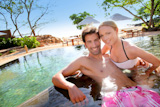 Couple relaxing in luxury hotel swimming-pool