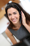 Portrait of smiling receptionist with headphones