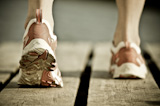Feet of jogging man. Vintage tinted image