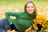 portrait of young woman in autumnal park