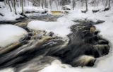 flowing winter waters at Nommeveski waterfall, Estonia