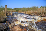 river flow on old destroyed dam