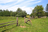 wooden,fence,on,green,pasture