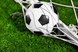 Soccer ball and goal net, selective focus