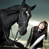 Beautiful,young,woman,with,a,black,horse