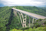Tall bridge over a green valley in Cuba