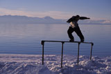snowboarder+lakeside+rail+slide