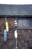 Buoys+Hanging+on+a+Shingled+Wall