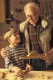Grandfather+Helping+Grandson+in+Wood+Shop