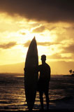 Man+and+Surfboard+at+Sunset