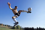 Man+Kicking+a+Soccer+Ball+in+Mid+Air