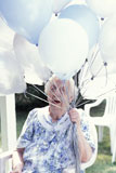 Old+Lady+Holding+a+Bunch+of+Balloons
