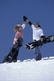 Snowboarding+Couple+High-Fiving