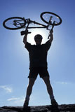 Man+Holding+Bike+Above+His+Head