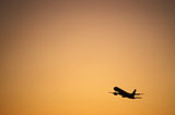 Airplane+Taking+off+at+Sunset