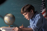 Boy+Taking+Notes+In+Geography+Classroom