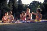 Girls+Wearing+Swimsuits+And+Having+A+Picnic+In+Park