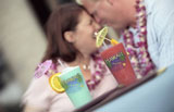 Couple+Sharing+A+Happy+Moment+With+Mixed+Fruit+Drinks+In+Hawaii