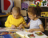 Children+Reading+Books+Together+In+Classroom