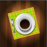 Cup of coffee, spoon and napkin on wooden background