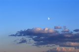 Moon+And+Clouds+In+A+Clear+Blue+Sky+At+Dusk