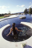 Woman+Stepping+Into+An+Outdoor+Pool
