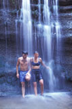 Man+and+Woman+Standing+Under+a+Waterfall