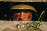 Male+Soldier+Staring+Out+Of+Bunker