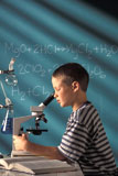 Boy+Looking+Into+Microscope+In+Classroom