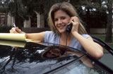 Woman+On+Cell+Phone+With+Car