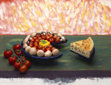 Slice+of+quiche+served+with+a+decorative+platter+of+mushrooms+and+tomatoes