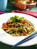Close-up+of+beef+and+stir+fried+noodles+with+chopsticks+on+a+platter