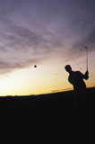 Silhouette+of+a+man+playing+golf