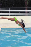 Young+woman+diving+into+a+swimming+pool