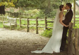 A+newly+married+couple+kissing+each+other+on+a+farm