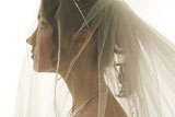 Side+profile+of+a+young+bride+wearing+a+veil